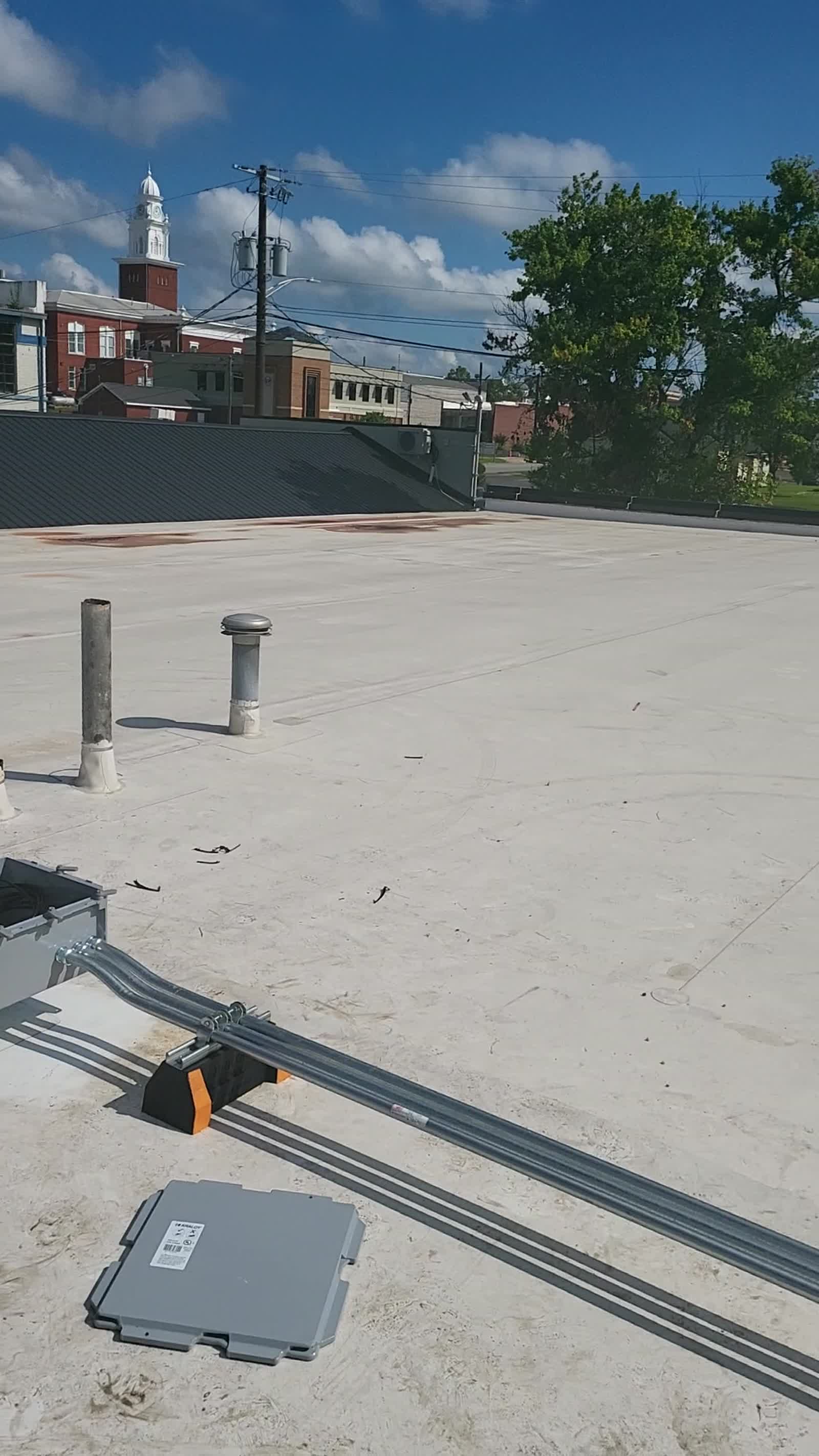 Rooftop conduit installation at Southerly Warehouse